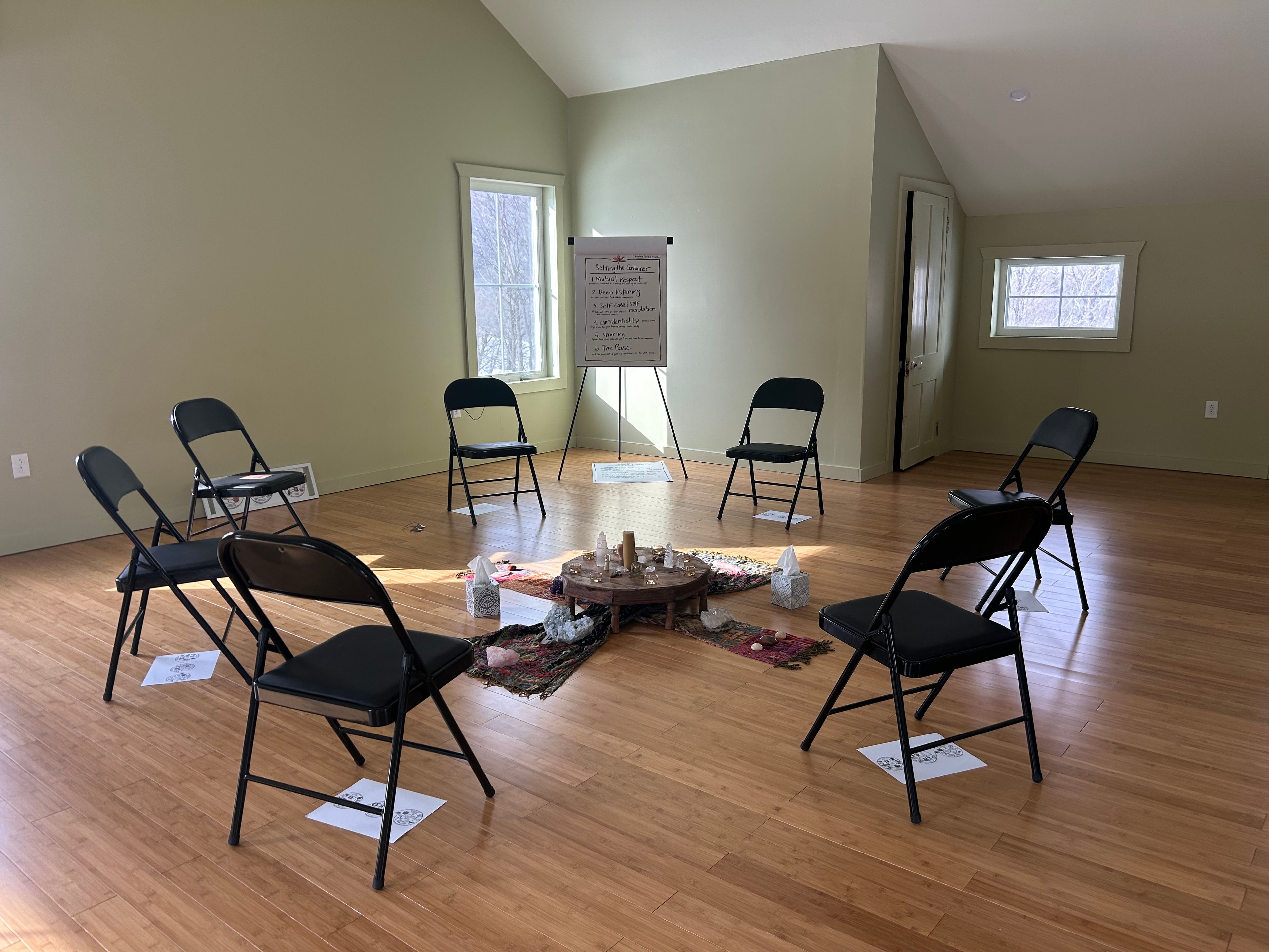 Cozy gathering room with crystal altar and candles